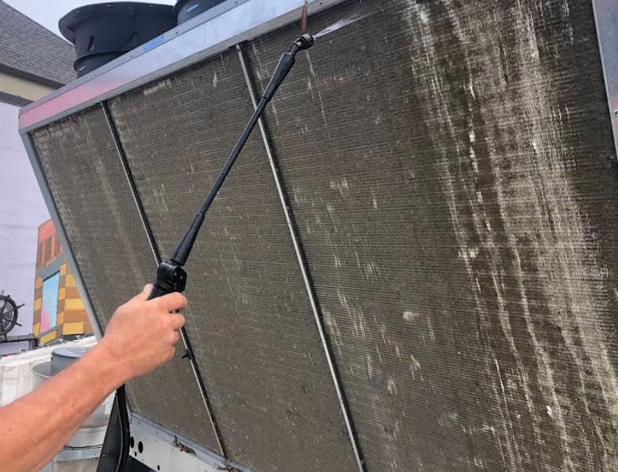 technician cleaning hvac system in Memphis home